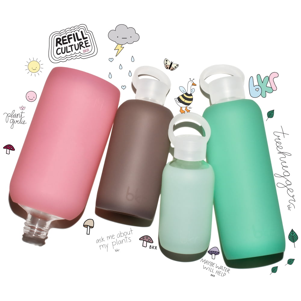 bkr Earth Day stickers with glass and silicone reusable water bottles in sheer sugary warm pink, sheer malt coco brown, sheer mint sea glass, and sheer tropical shallow sea green.