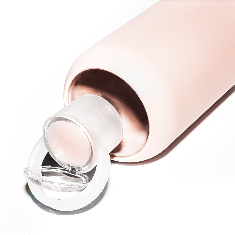 Glass & silicone lip balm water bottle in opaque ballet pale peachy pink.