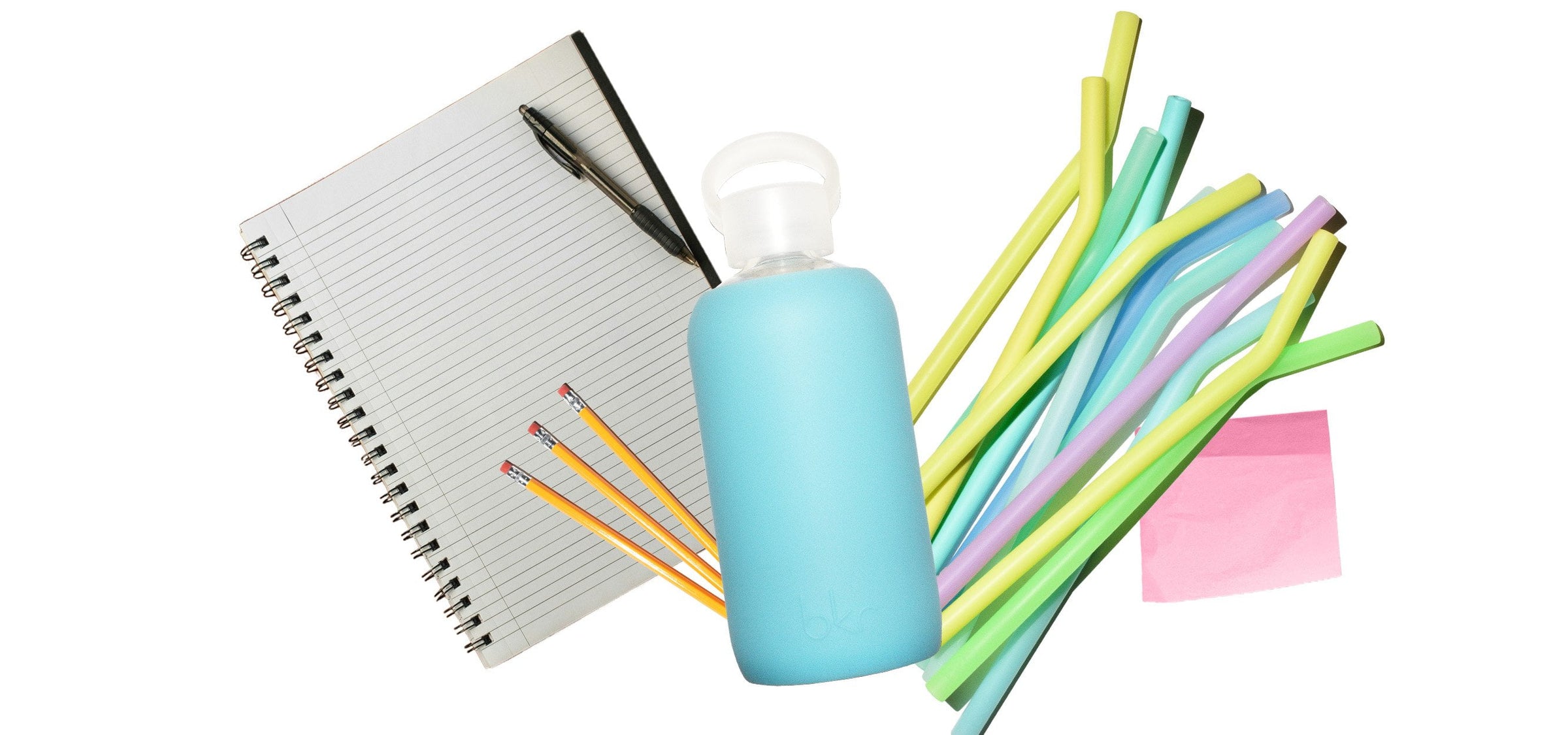 bkr glass and silicone water bottle with assorted straws and school supplies