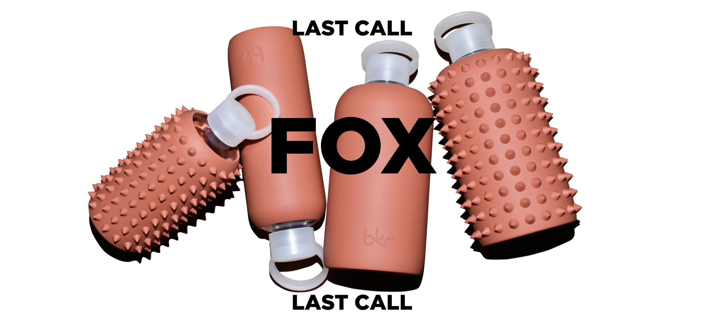 bkr glass and silicone reusable water bottles in opaque earthy ginger terracotta.