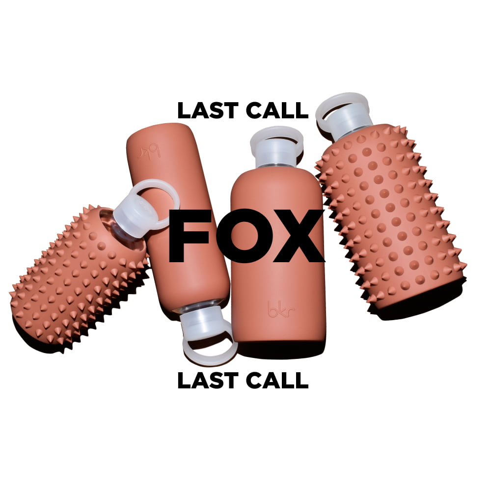 bkr glass and silicone reusable water bottles in opaque earthy ginger terracotta.