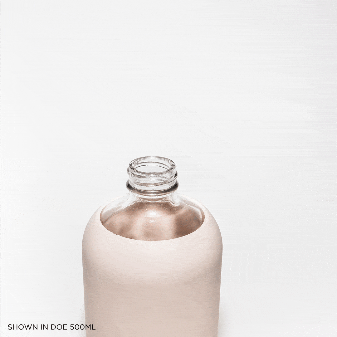 Glass bottle with straw