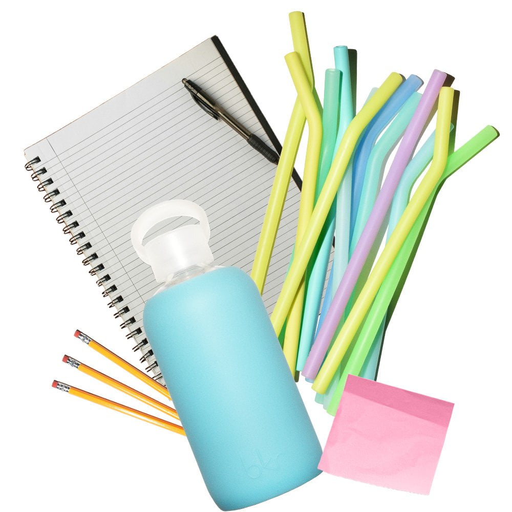 bkr glass and silicone water bottle with assorted straws and school supplies